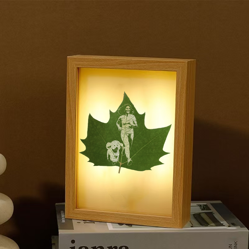 Unique eco leaf engraving of a small dog with its owner – sustainable pet loss gift idea
