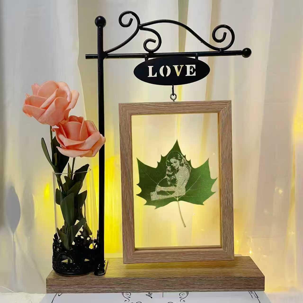 Unique handcrafted leaf carving of a girl holding her blue cat – personalized cat memorial gift and eco-friendly keepsake